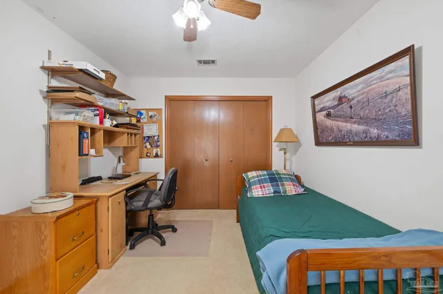 a view of balcony with wooden floor and fence
