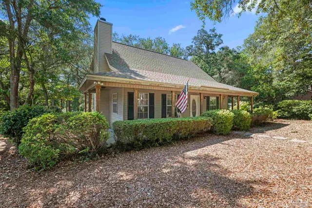 a view of front of house with a yard