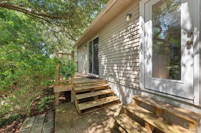 a view of backyard with patio