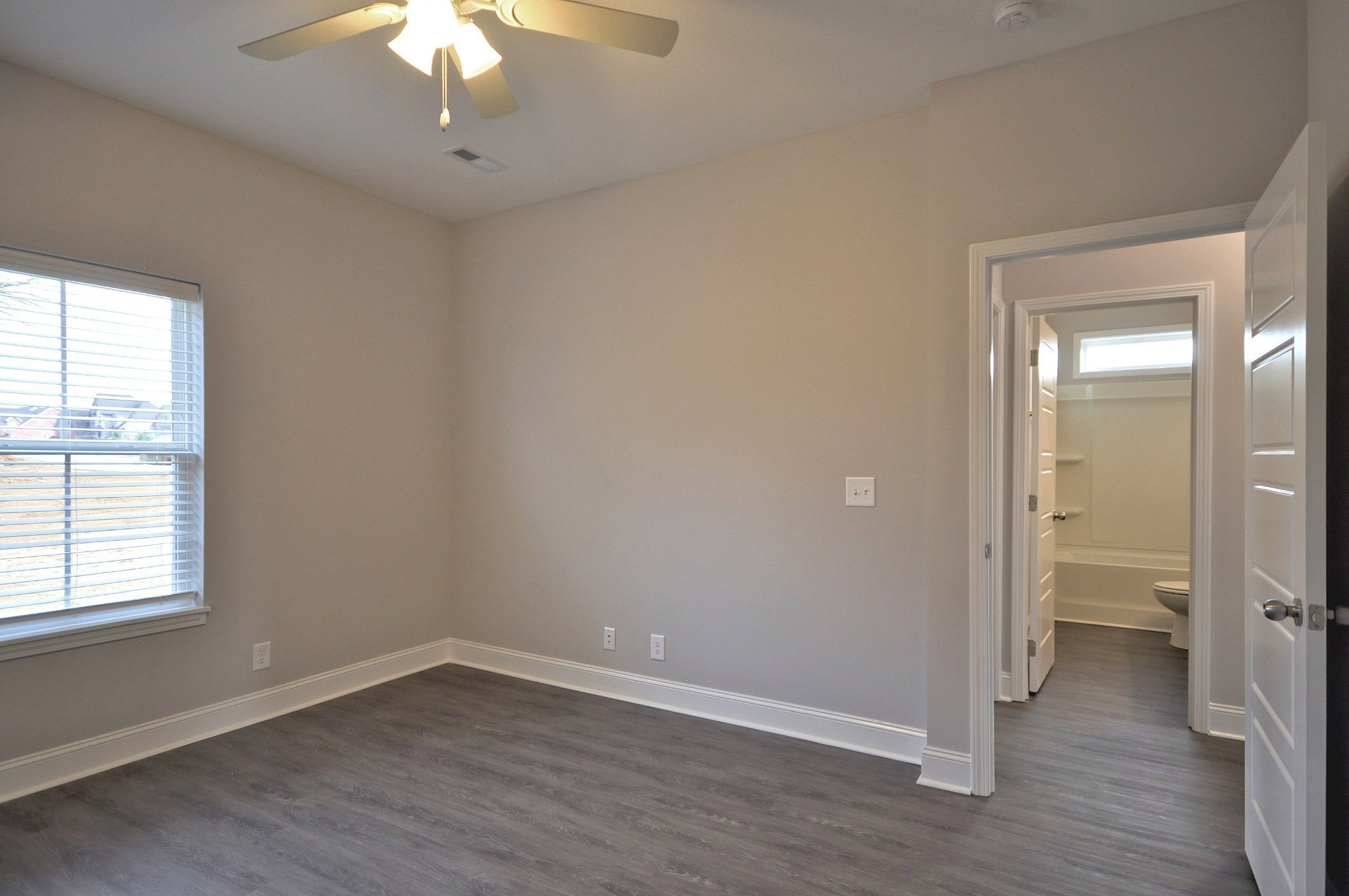 200 Bainbridge Drive, Unit A Clarksville, TN 37043 - Photo 21 of 35 wooden floor in an empty room with a window