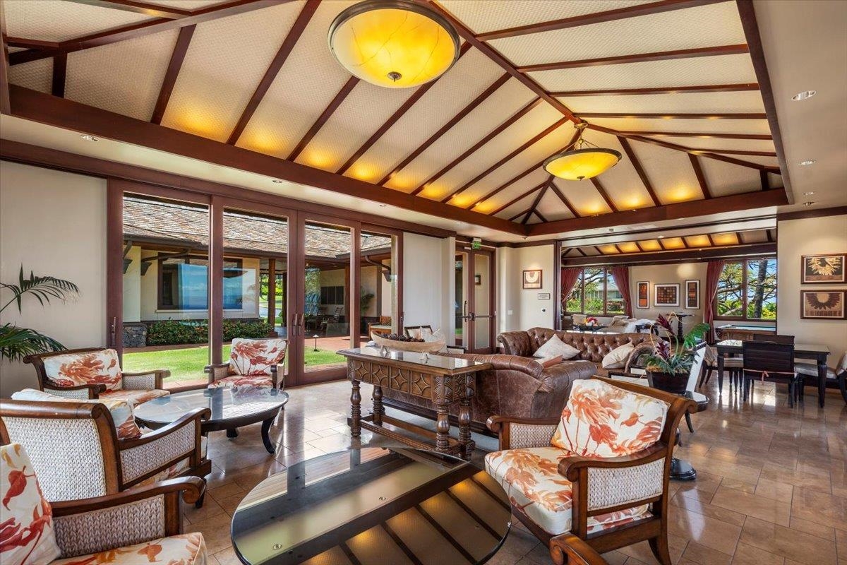 4 Anapuni Loop Lahaina, HI 96761 - Photo 42 of 44 a living room with fireplace furniture and a large window