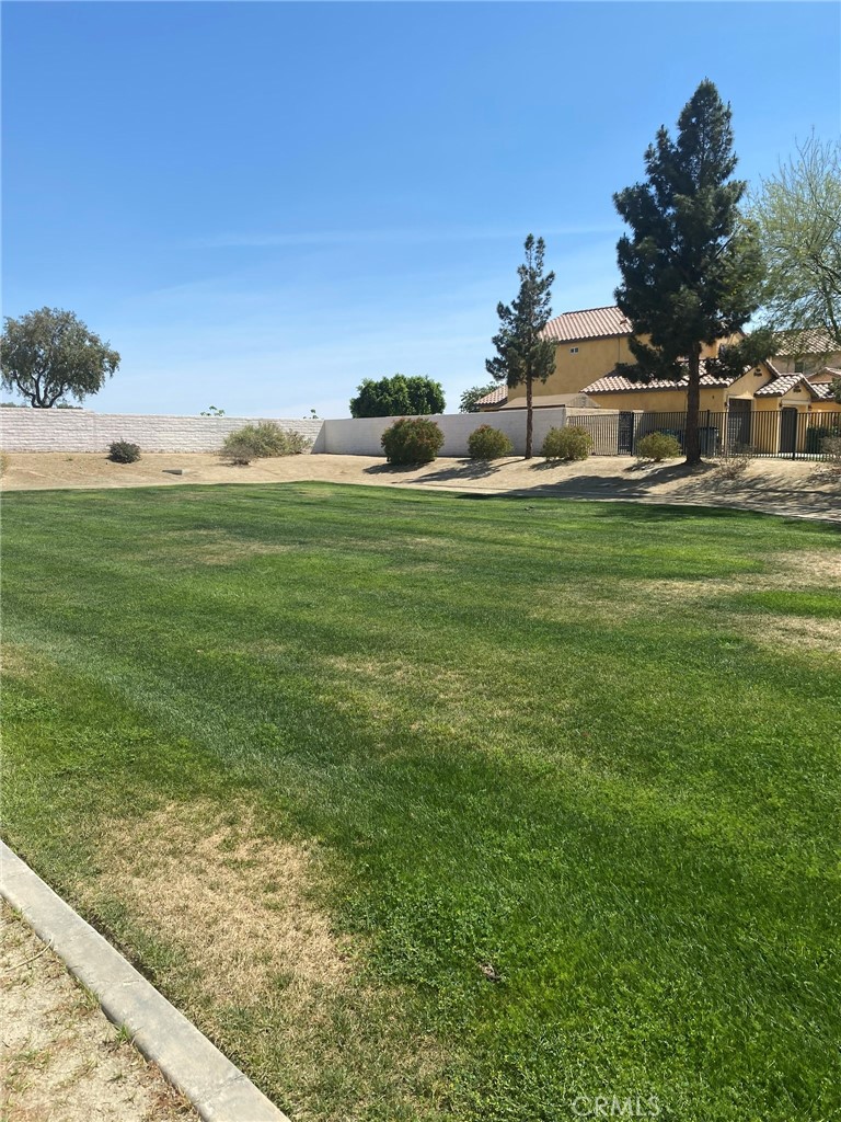 0 San Rey Drive Coachella, CA 92236 - Photo 6 of 10 a front view of a house with a garden