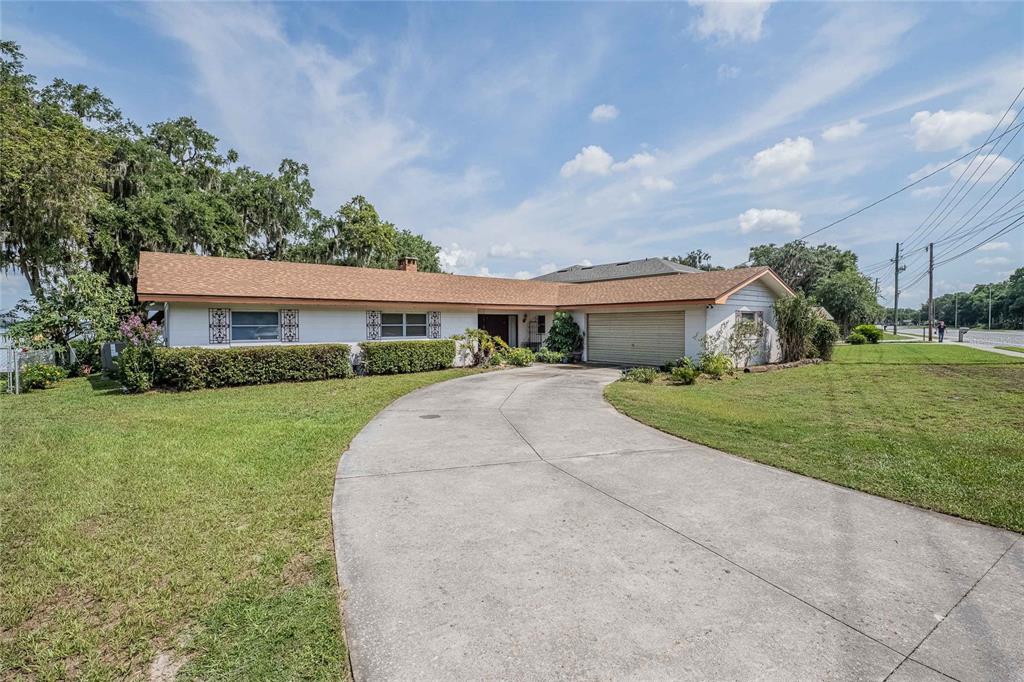 5026 North Socrum Loop Road Lakeland, FL 33809 - Photo 1 of 1 a front view of house with yard