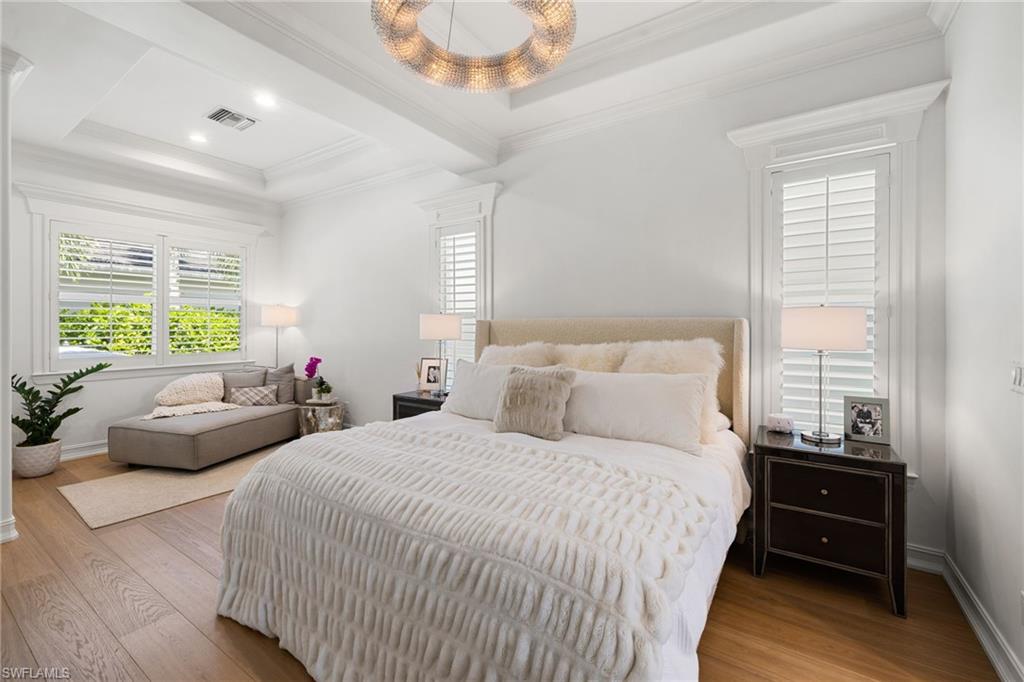 950 8th Street South Naples, FL 34102 - Photo 10 of 21 a bedroom with a bed and a couch