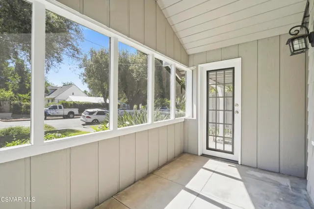 a view of an empty room with windows