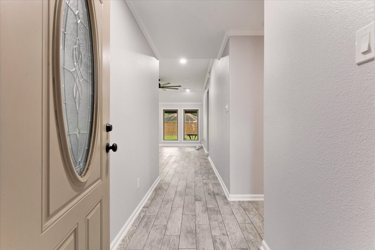 6123 Springhaven Drive Houston, TX 77396 - Photo 5 of 36 Welcoming entry with wood-look tile flooring and a view into the living area.