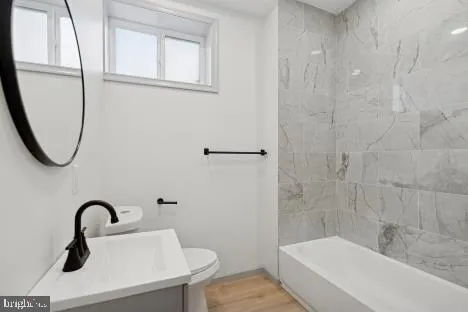 a bathroom with a sink a mirror and a shower