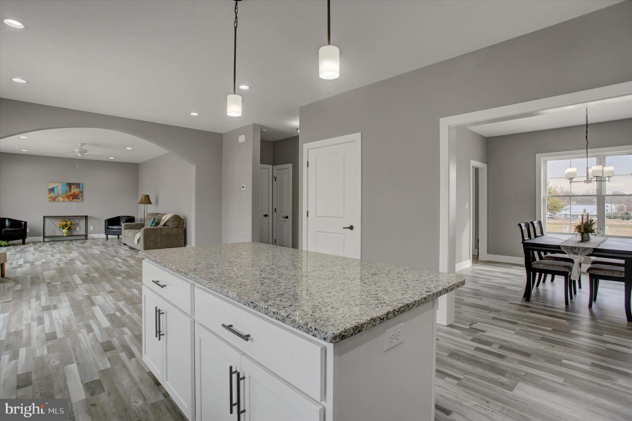 67 James Way Greencastle, PA 17225 - Photo 15 of 41 a kitchen with stainless steel appliances granite countertop wooden floor a dining table and chairs