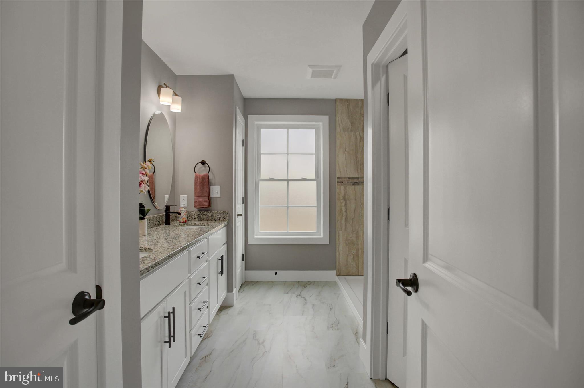 67 James Way Greencastle, PA 17225 - Photo 24 of 41 a bathroom with a granite countertop sink a vanity and a mirror