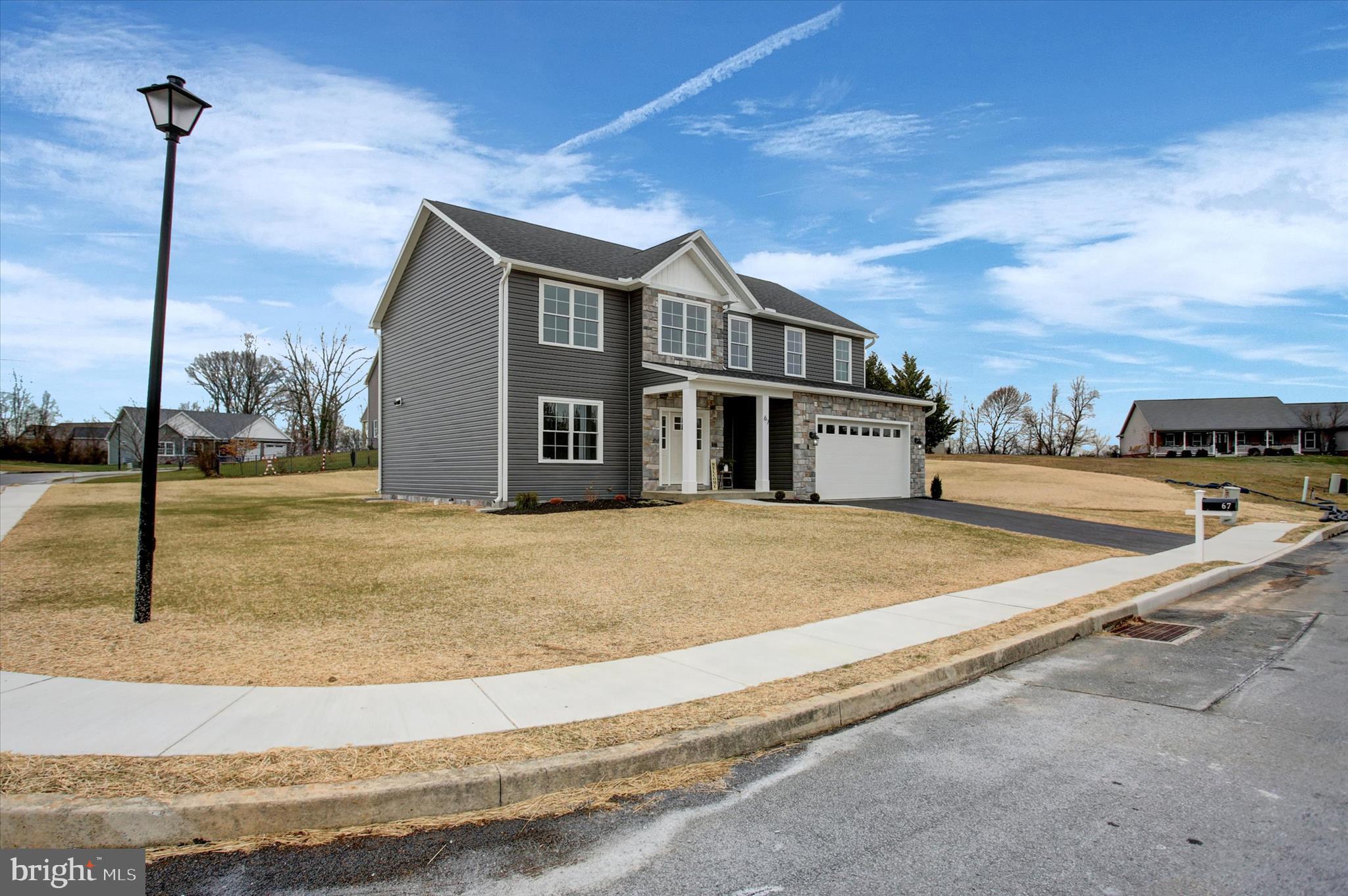 67 James Way Greencastle, PA 17225 - Photo 4 of 41 a front view of a house with a garden