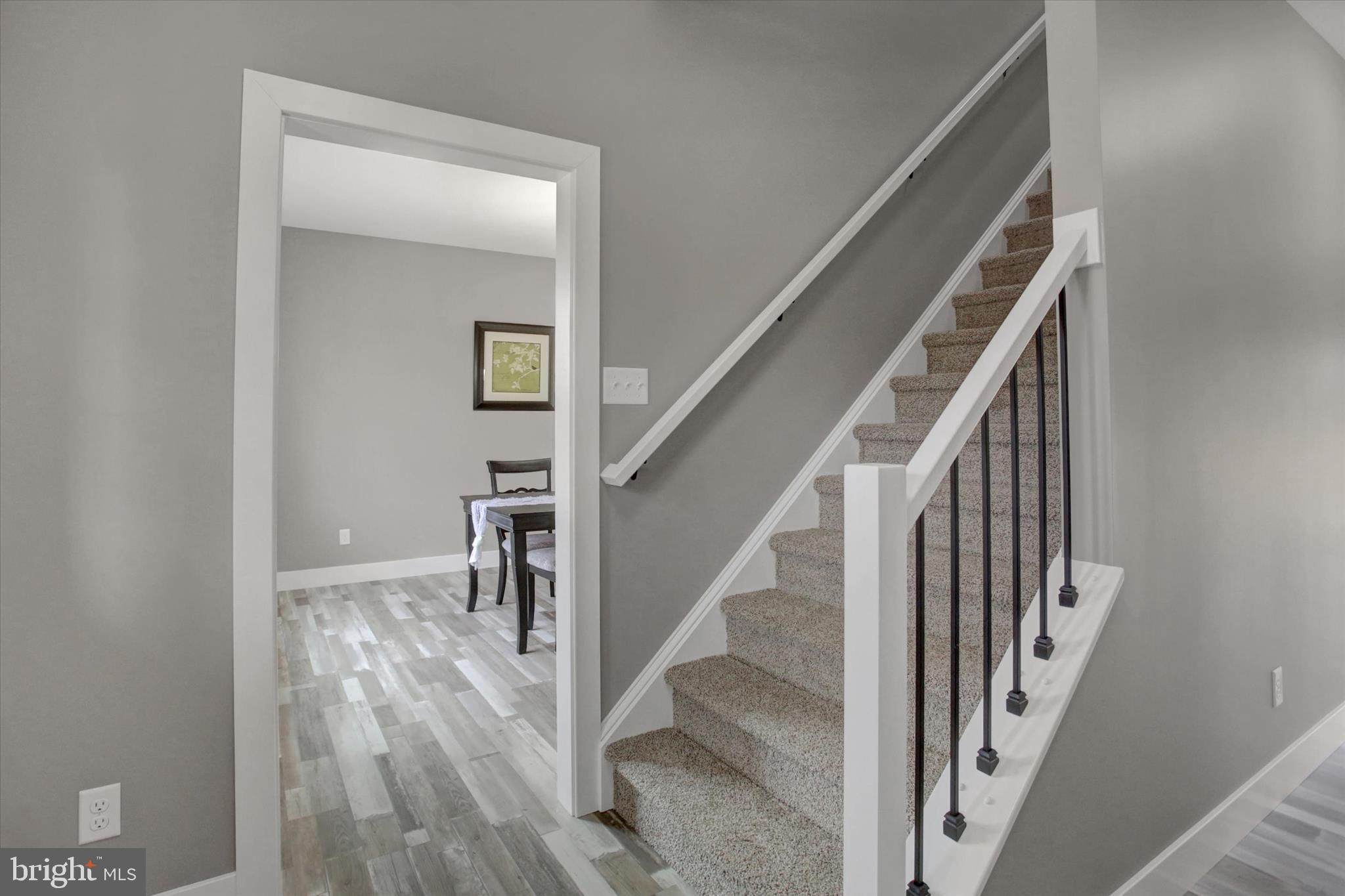 67 James Way Greencastle, PA 17225 - Photo 7 of 41 a view of staircase with wooden floor and white walls