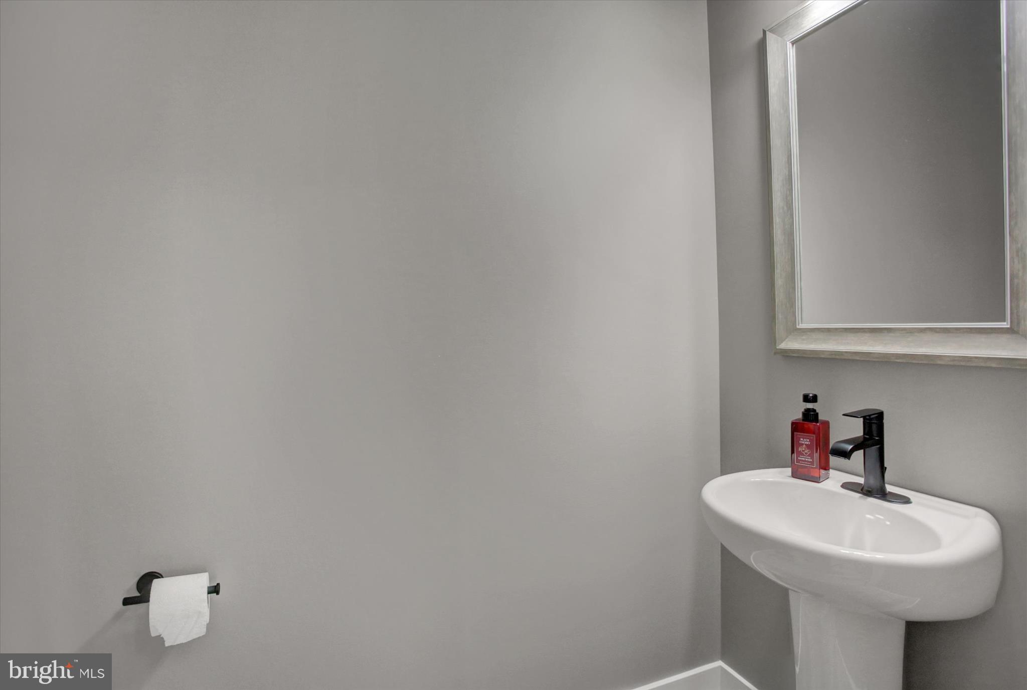 67 James Way Greencastle, PA 17225 - Photo 8 of 41 a bathroom with a sink and a mirror