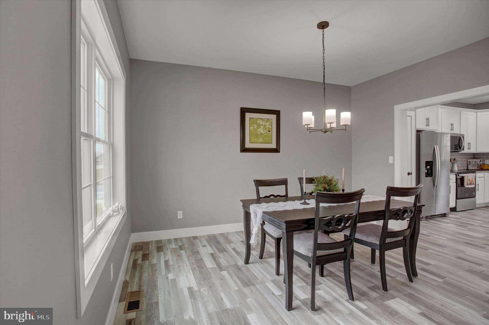 67 James Way Greencastle, PA 17225 - Photo 9 of 41 a view of a dining room with furniture window and wooden floor
