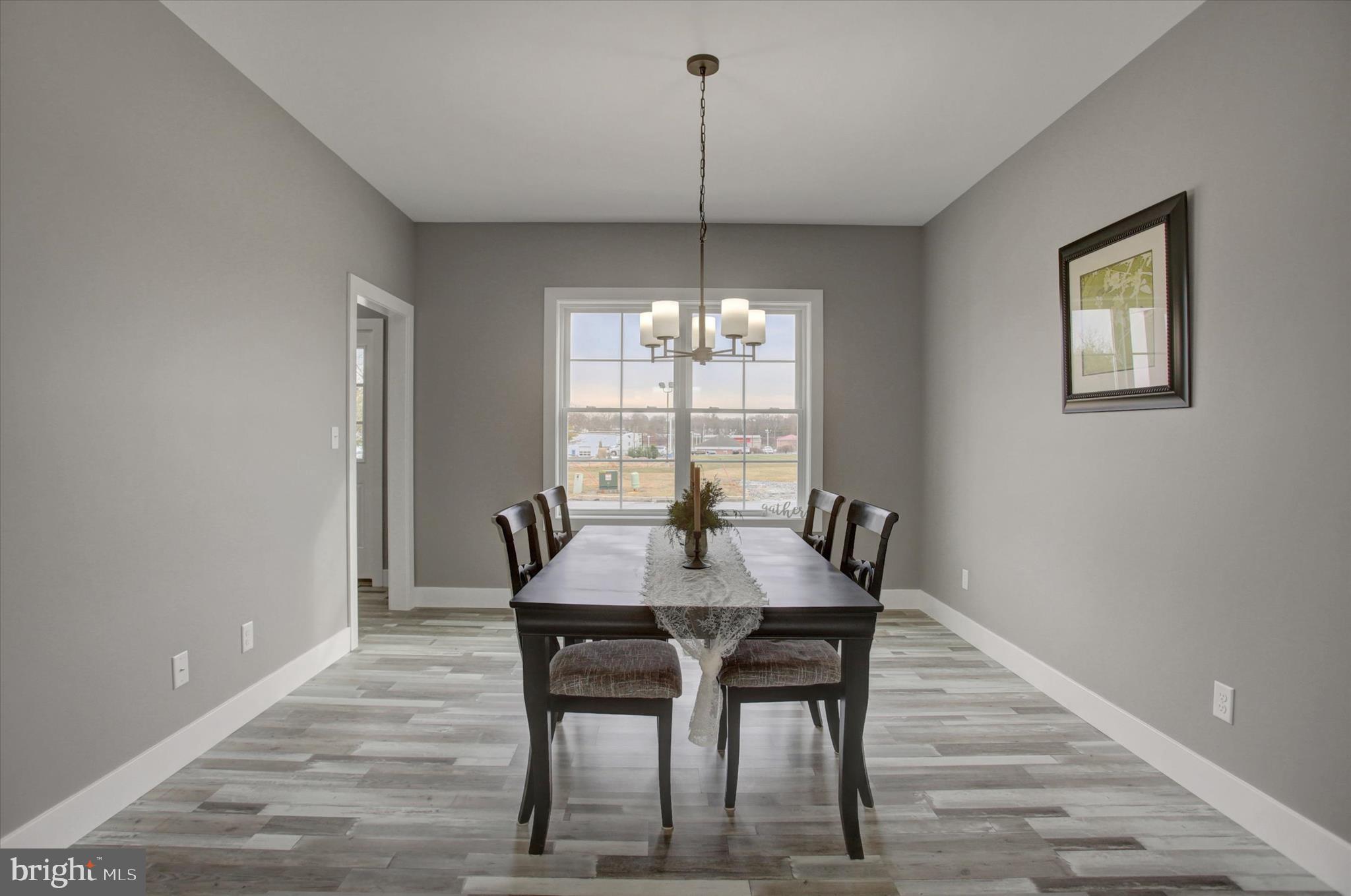 67 James Way Greencastle, PA 17225 - Photo 10 of 41 a dining room with furniture a chandelier and wooden floor