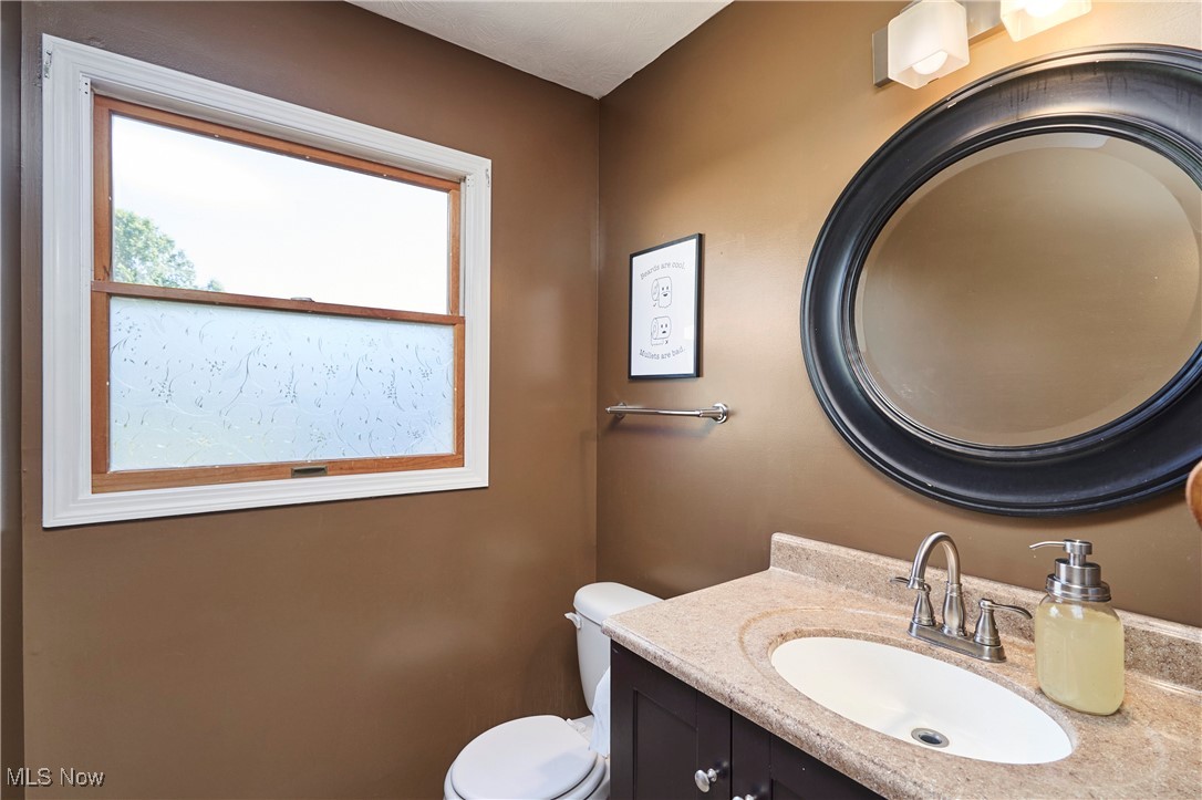 3741 Bassett Road Rootstown, OH 44272 - Photo 10 of 29 Half bathroom featuring vanity and toilet