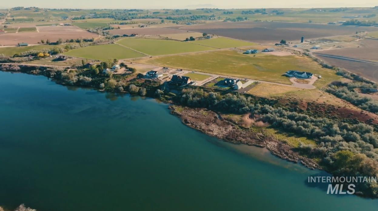 Tbd Tbd Tbd Cabernet Lane Caldwell, ID 83607 - Photo 23 of 23 Expansive waterfront property featuring a large body of water, green landscape, and mature trees