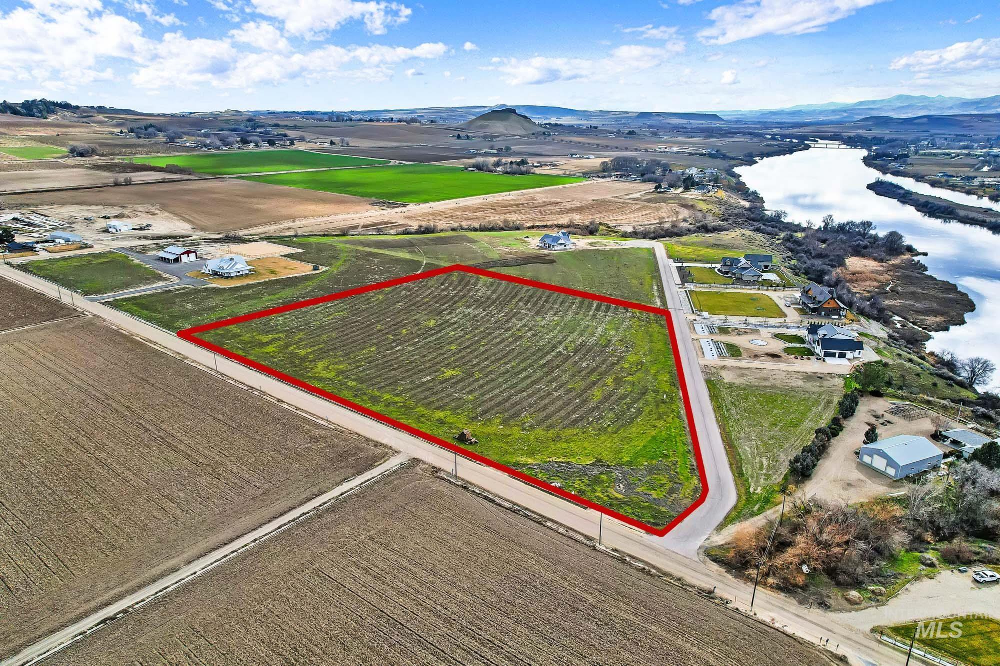 Tbd Tbd Tbd Cabernet Lane Caldwell, ID 83607 - Photo 9 of 23 Aerial view of sparsely populated area featuring property parcel outlined, large plots for crops, and a mountain backdrop