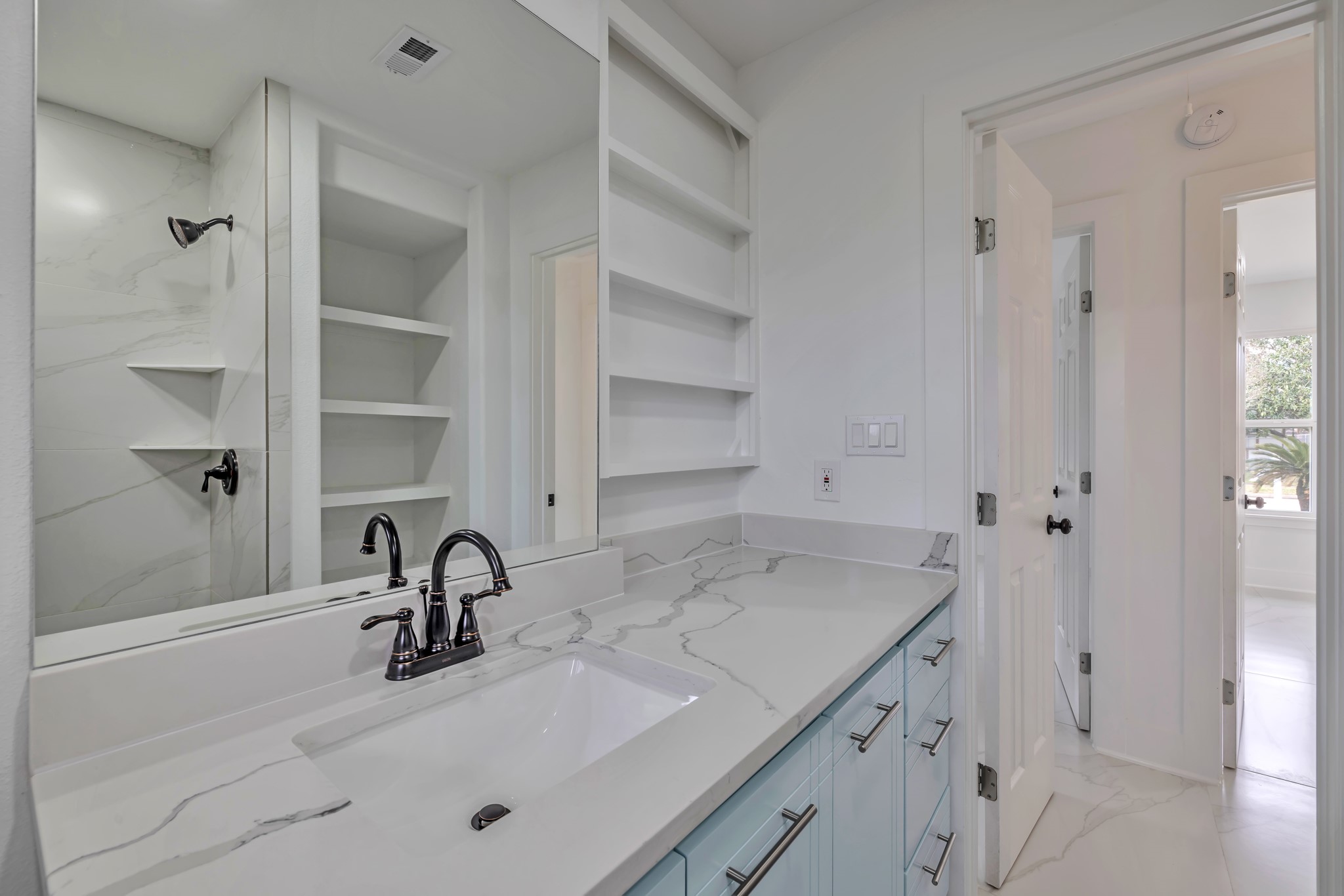 8709 Tarbell Road Houston, TX 77034 - Photo 12 of 25 a bathroom with a sink and a mirror