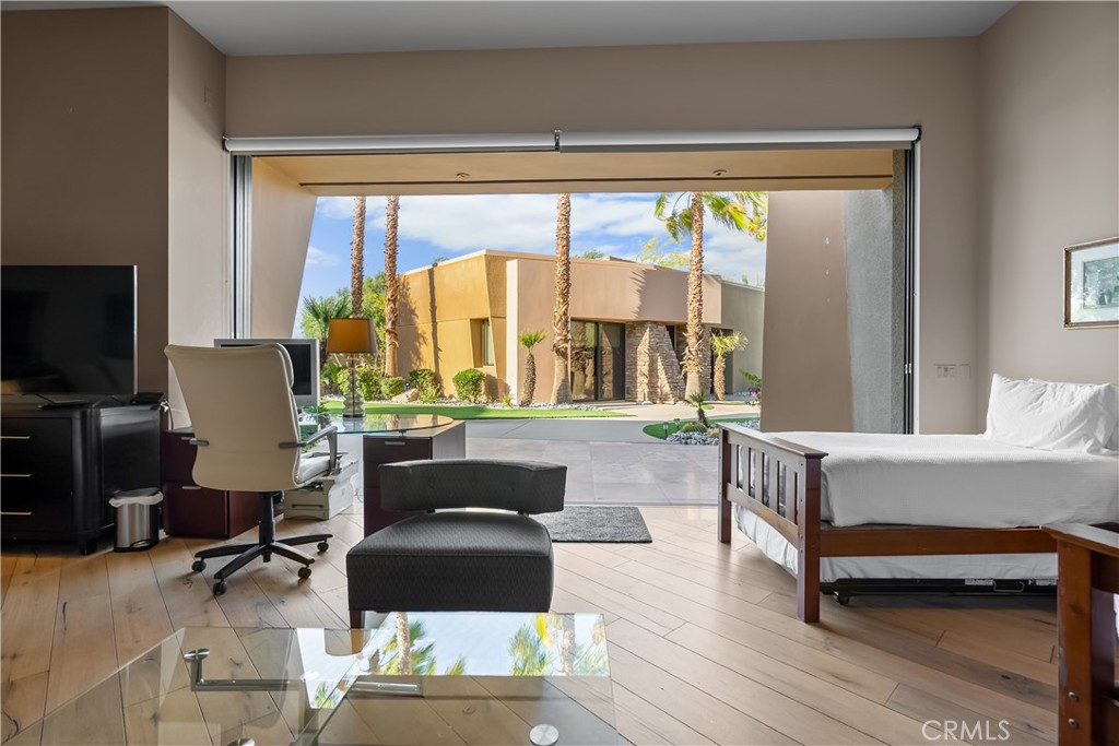 68 Royal St Georges Way Rancho Mirage, CA 92270 - Photo 58 of 75 a living room with furniture and a large window