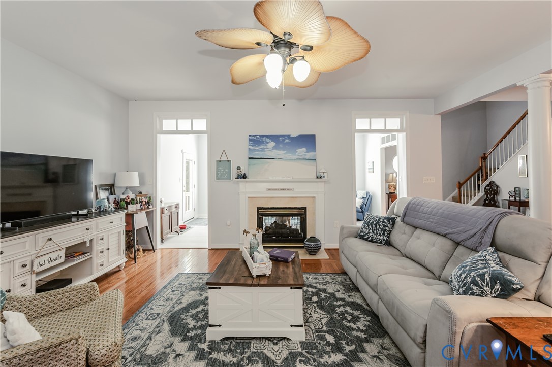 1113 Alcorn Terrace Midlothian, VA 23114 - Photo 16 of 44 a living room with furniture a flat screen tv and a fireplace