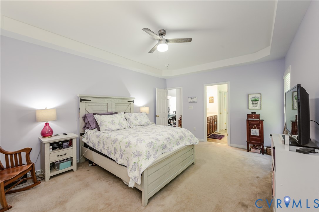 1113 Alcorn Terrace Midlothian, VA 23114 - Photo 29 of 44 a bedroom with a bed and a chandelier