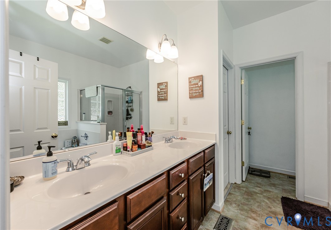 1113 Alcorn Terrace Midlothian, VA 23114 - Photo 37 of 44 a bathroom with a sink double vanity and a mirror