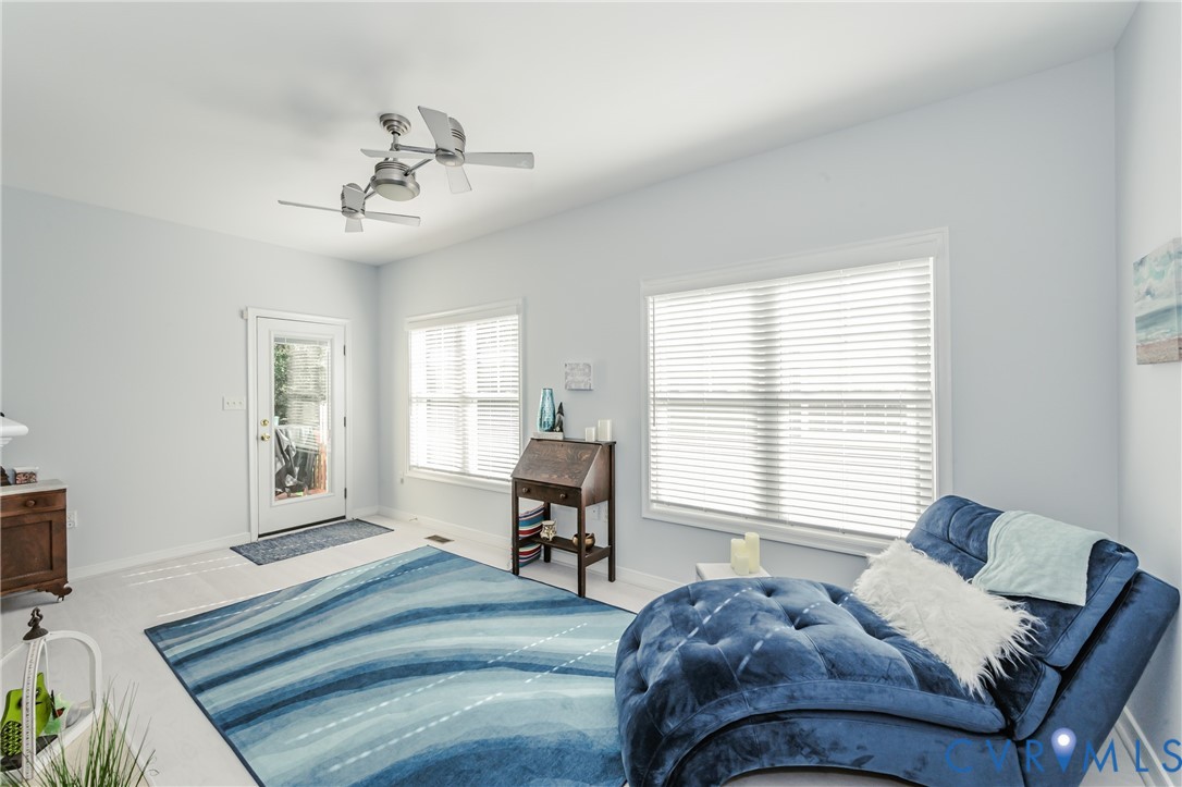 1113 Alcorn Terrace Midlothian, VA 23114 - Photo 10 of 44 a spacious bedroom with a bed and a chair