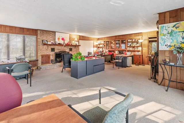 a living room filled with furniture and a flat screen tv