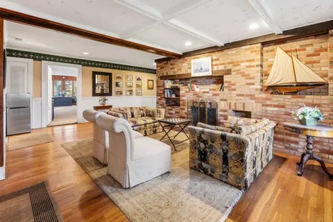 a living room with lots of furniture and a flat screen tv