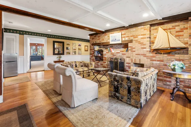 a living room with lots of furniture and a flat screen tv