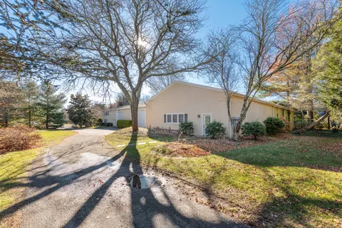 a view of a yard with snow on the road