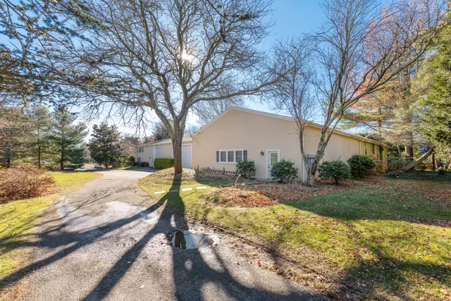a view of a yard with snow on the road