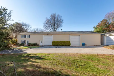 a view of a yard with a house