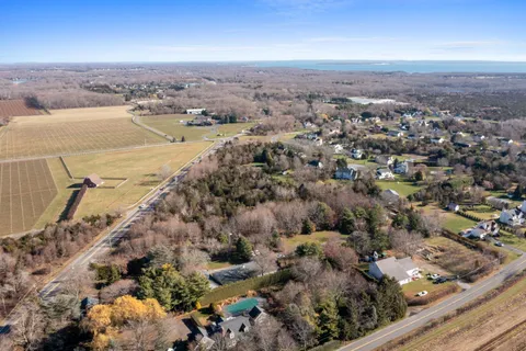 an aerial view of a house with a ocean view
