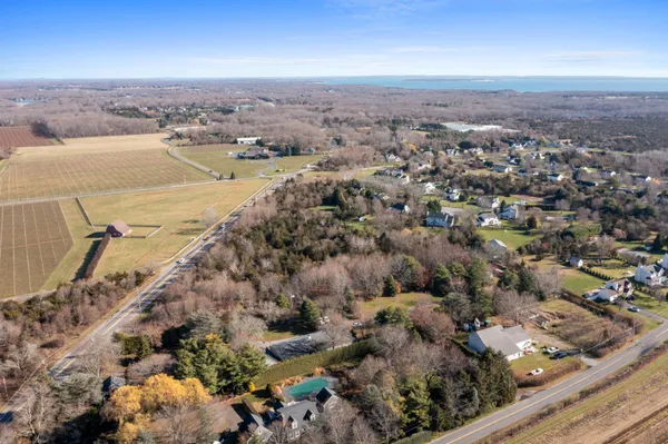 an aerial view of a house with a ocean view