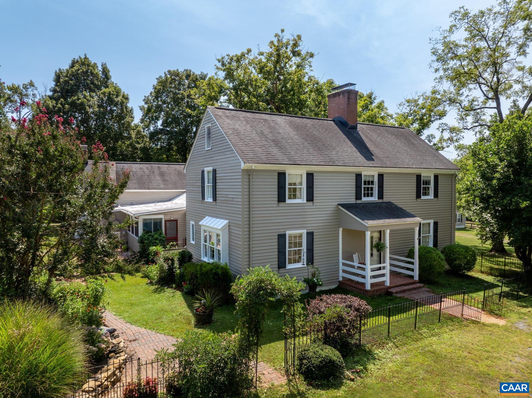 1128 Beaverdam Road Keswick, VA 22947 - Photo 14 of 74 a house with swimming pool in front of it