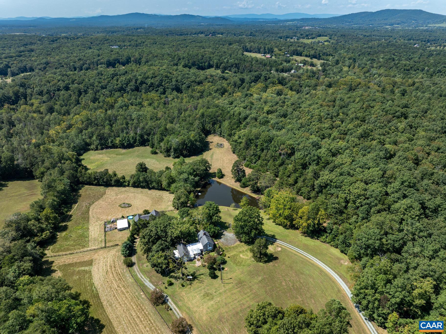 1128 Beaverdam Road Keswick, VA 22947 - Photo 2 of 74 an aerial view of a house with a yard