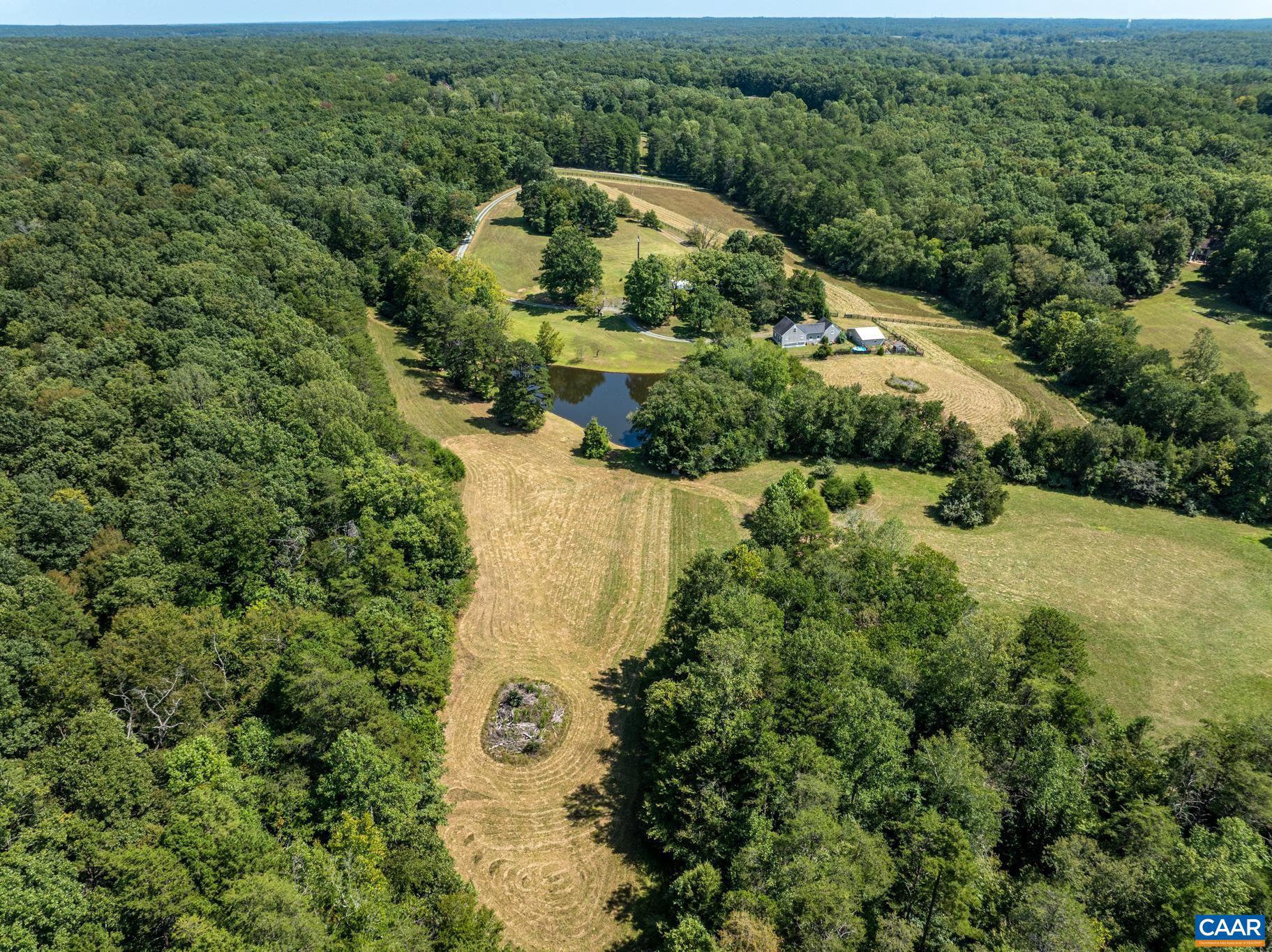 1128 Beaverdam Road Keswick, VA 22947 - Photo 3 of 74 an aerial view of a house with a yard