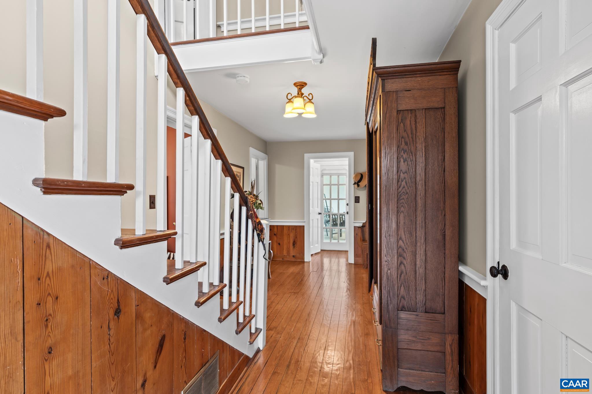 1128 Beaverdam Road Keswick, VA 22947 - Photo 31 of 74 a view of a hallway with wooden floor and staircase