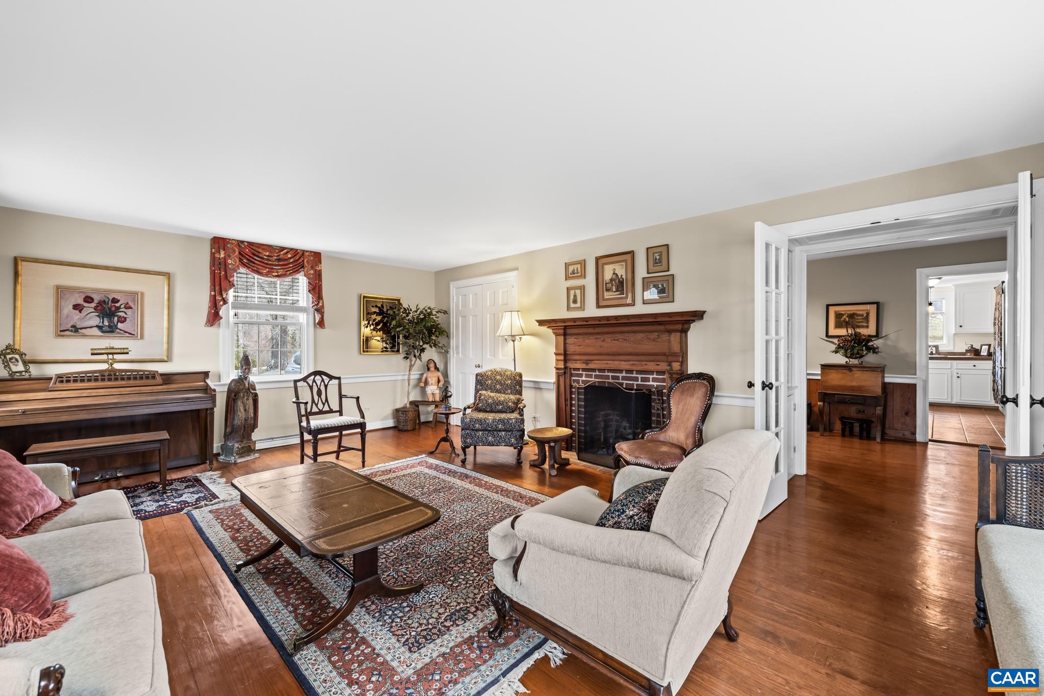 1128 Beaverdam Road Keswick, VA 22947 - Photo 33 of 74 a living room with furniture fireplace and wooden floor