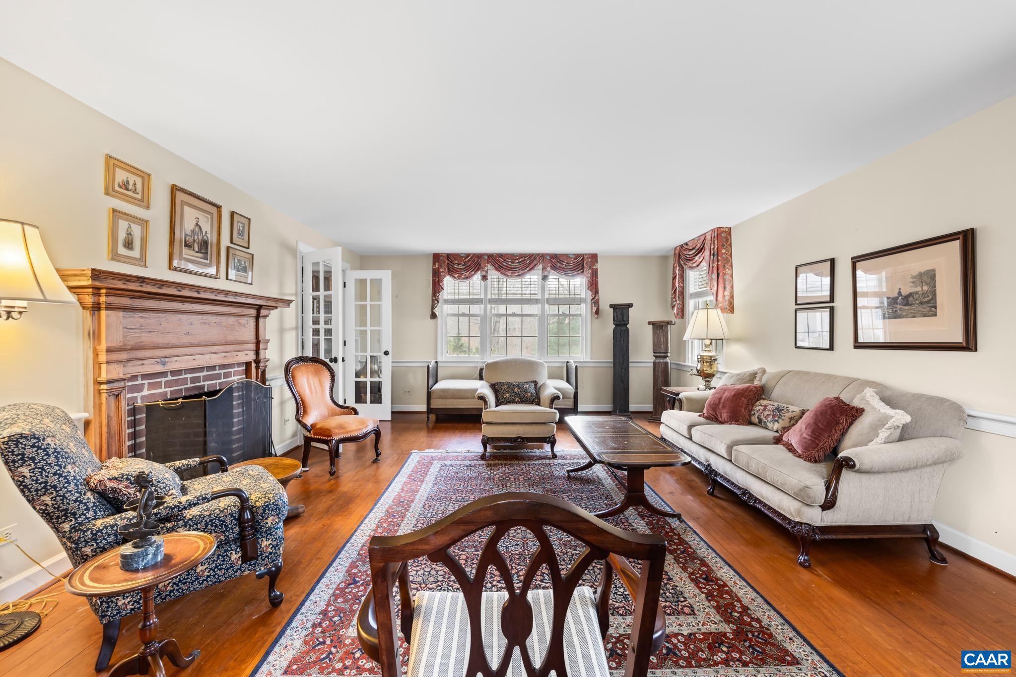 1128 Beaverdam Road Keswick, VA 22947 - Photo 34 of 74 a living room with furniture fireplace and rug