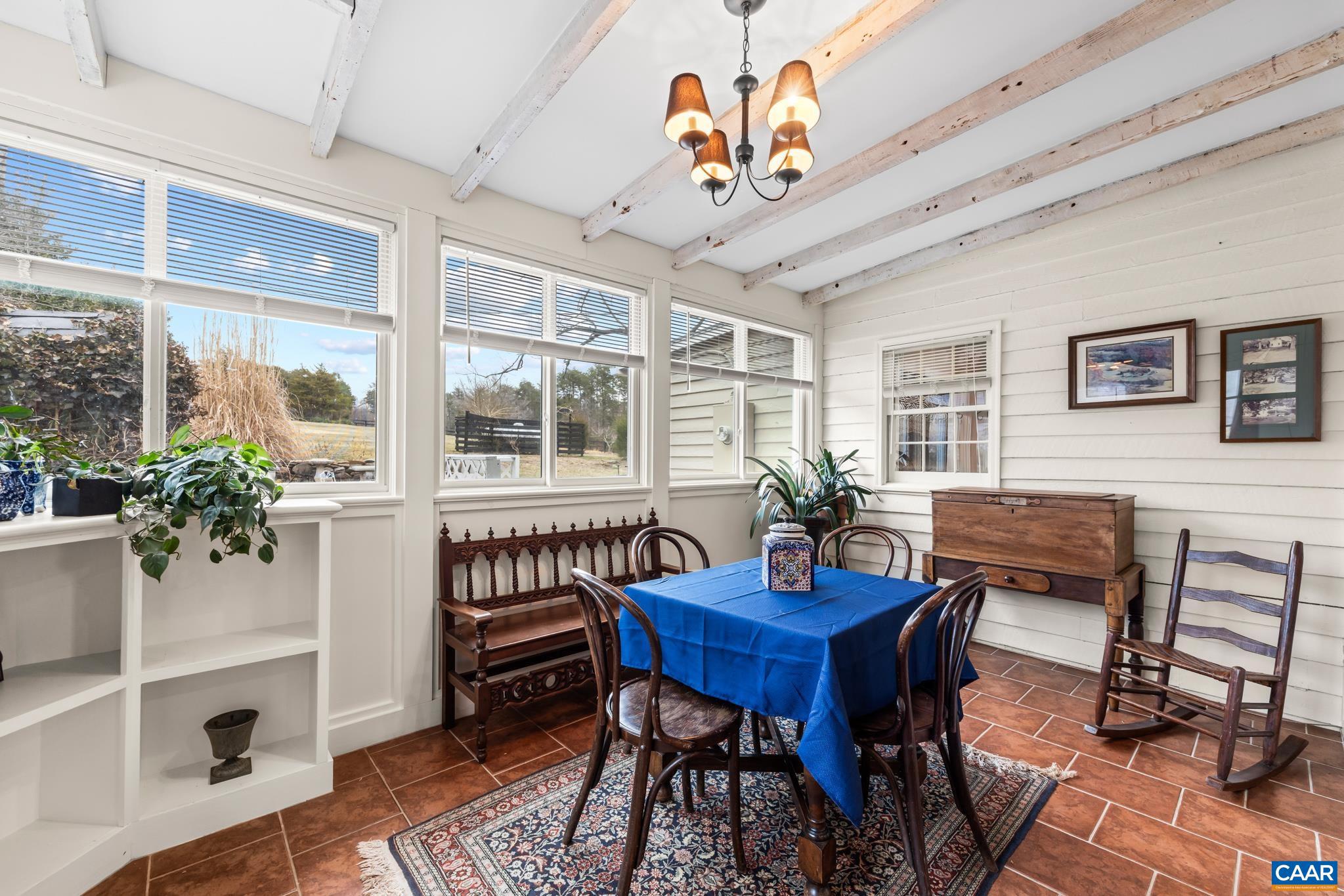 1128 Beaverdam Road Keswick, VA 22947 - Photo 44 of 74 a view of a dining room with furniture window and wooden floor