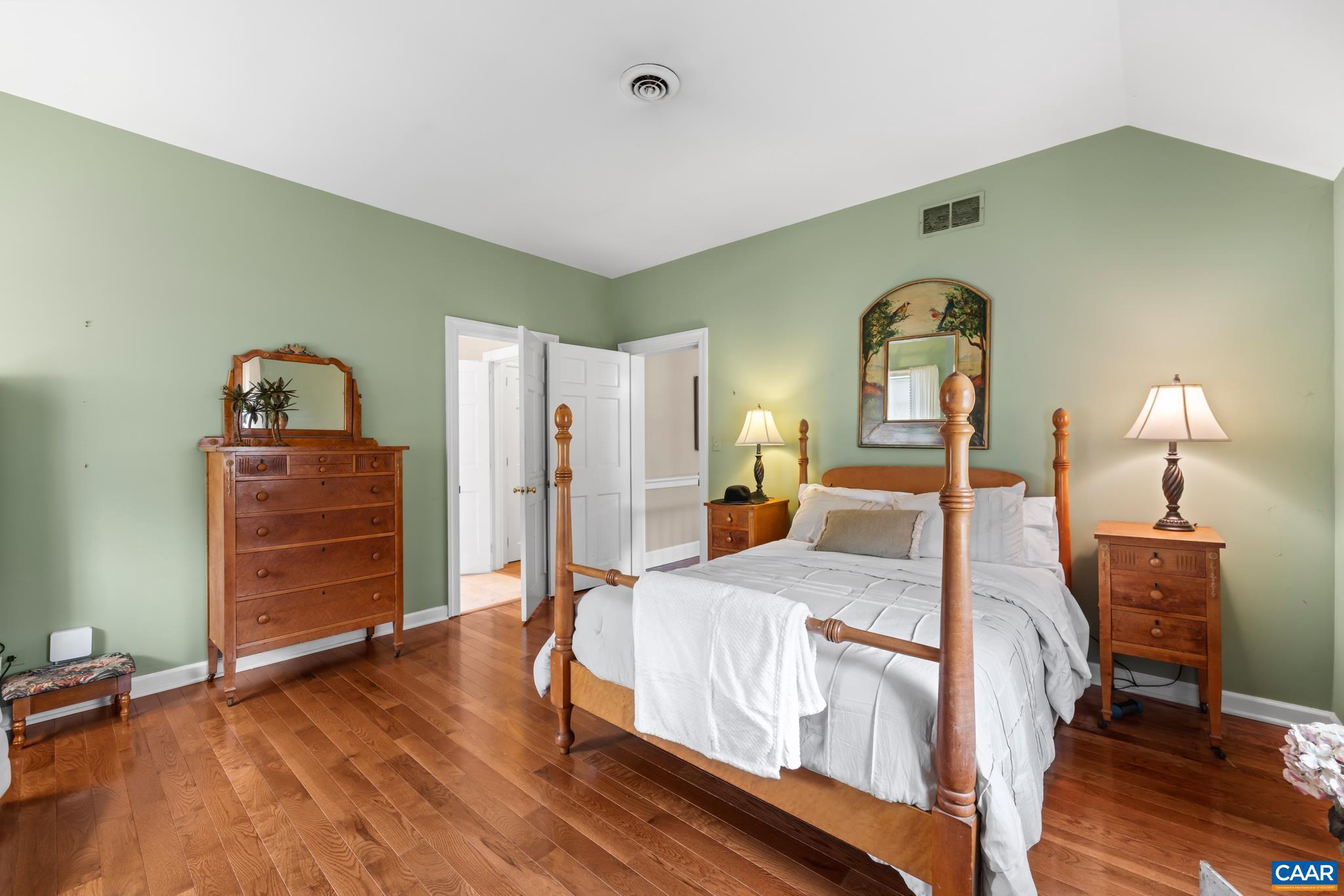 1128 Beaverdam Road Keswick, VA 22947 - Photo 60 of 74 a bedroom with a bed and a dresser