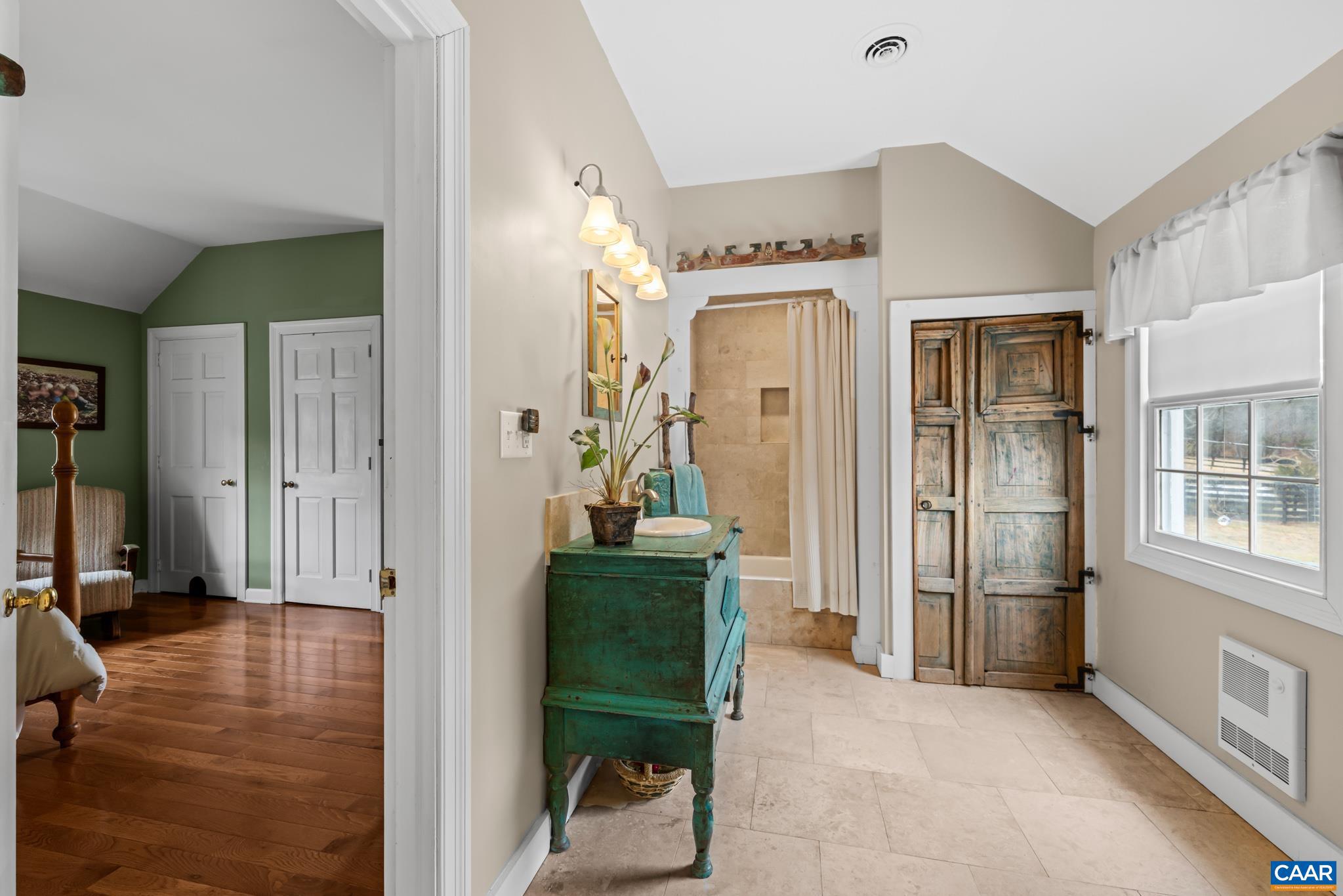1128 Beaverdam Road Keswick, VA 22947 - Photo 61 of 74 a view of a hallway with a livingroom and furniture