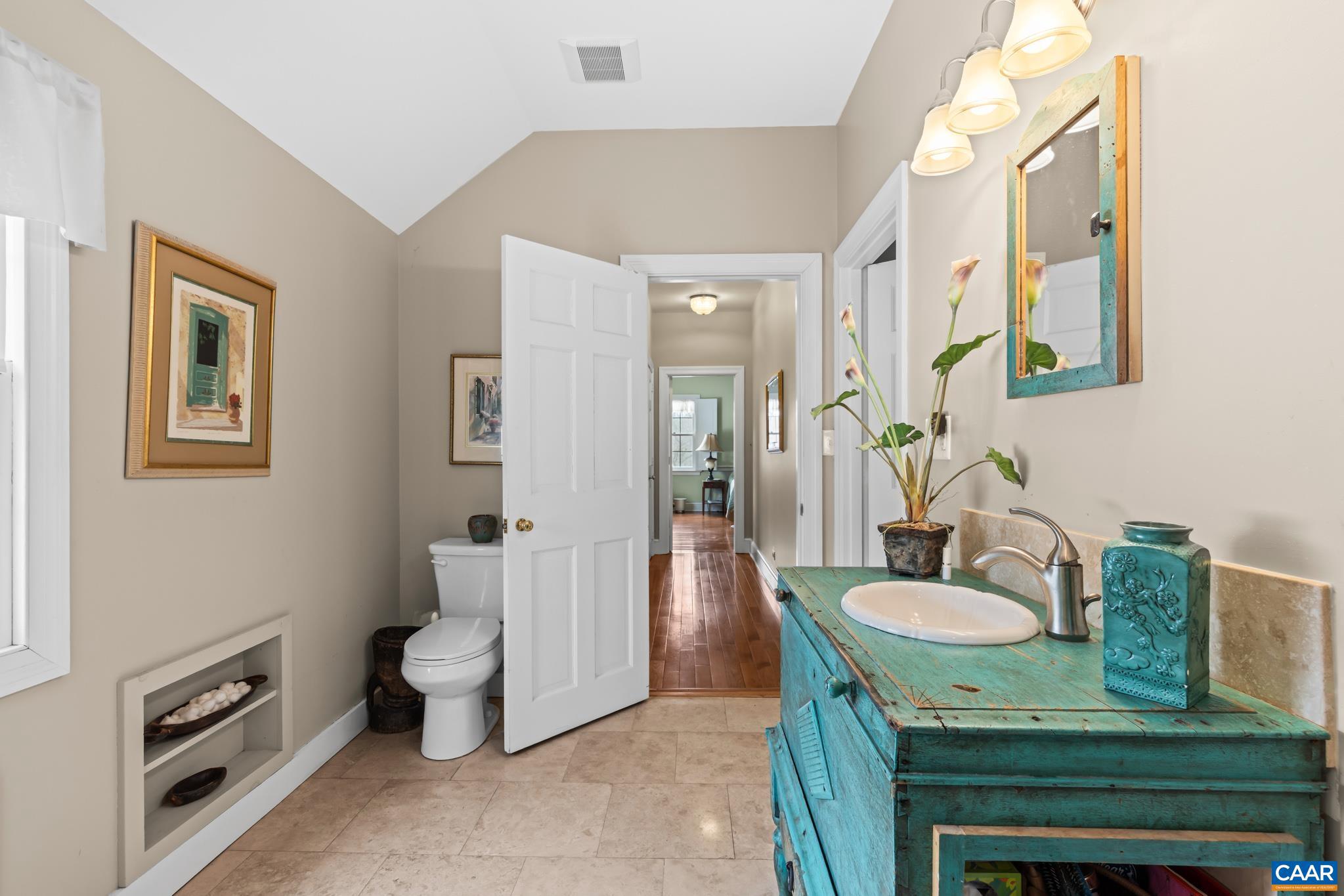 1128 Beaverdam Road Keswick, VA 22947 - Photo 63 of 74 a spacious bathroom with a granite countertop sink and a mirror
