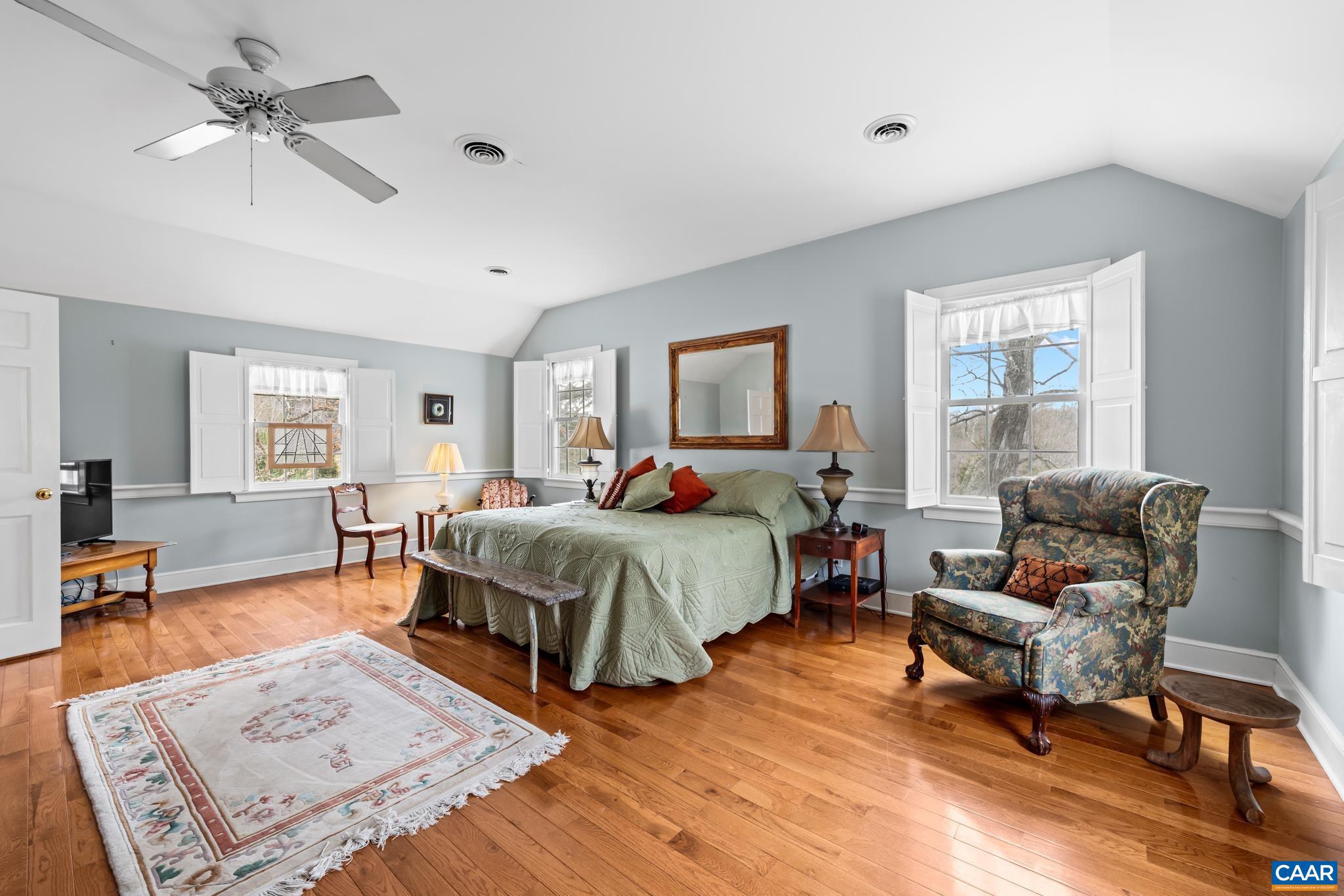 1128 Beaverdam Road Keswick, VA 22947 - Photo 64 of 74 a bedroom with a bed a couch and a window