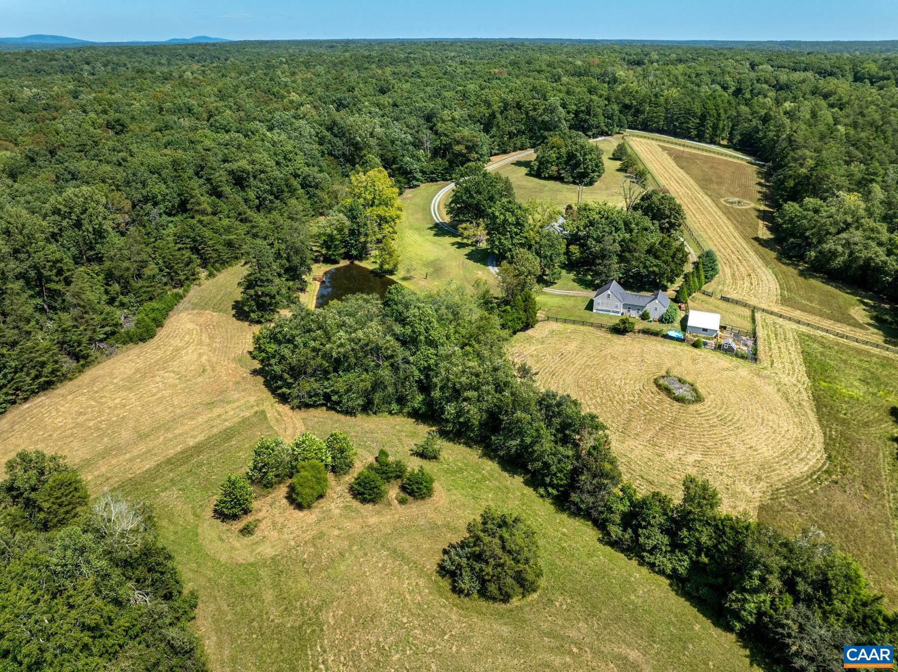 1128 Beaverdam Road Keswick, VA 22947 - Photo 67 of 74 a view of a garden with a swimming pool