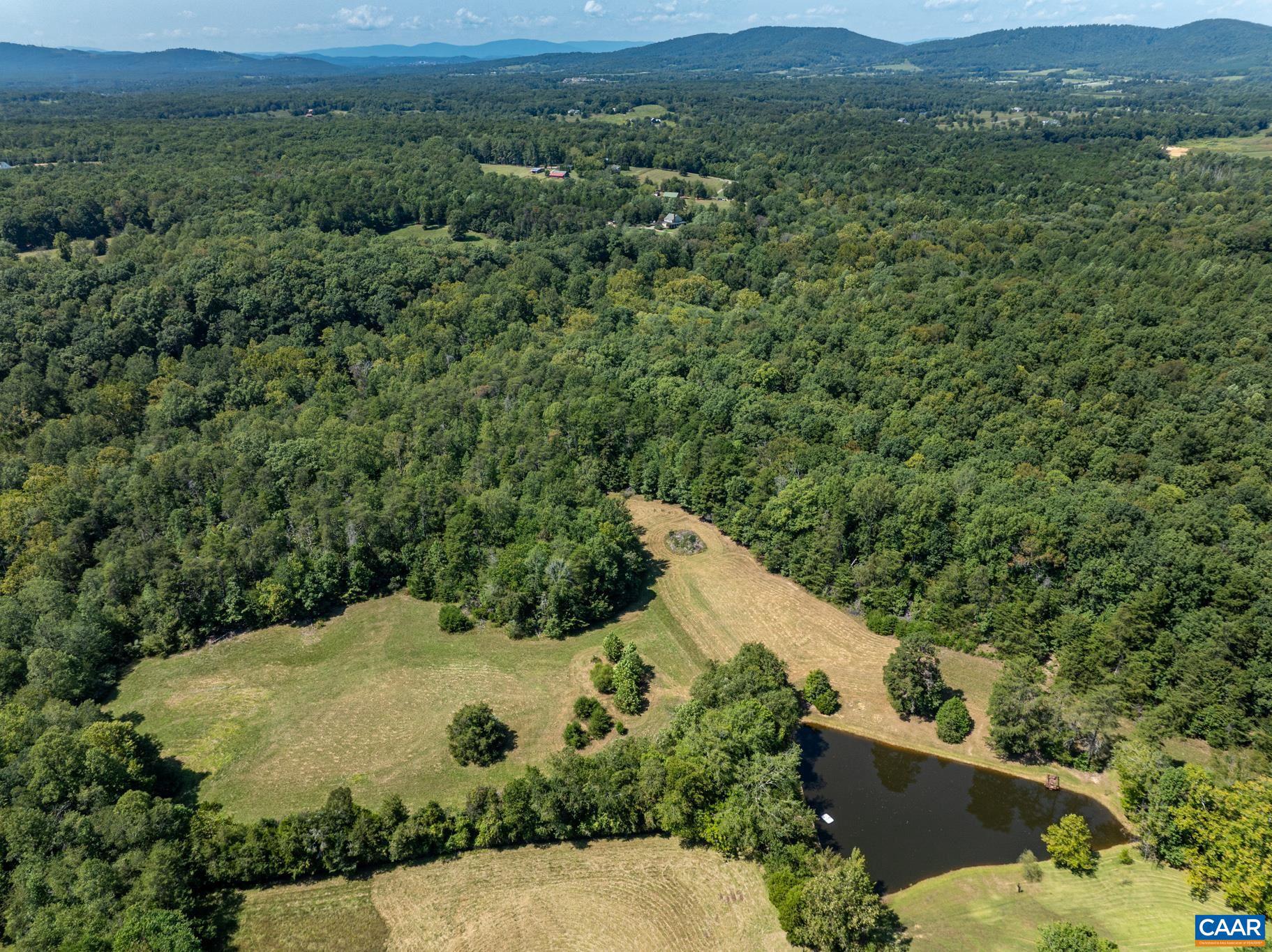 1128 Beaverdam Road Keswick, VA 22947 - Photo 68 of 74 a view of a field with a mountain in the background