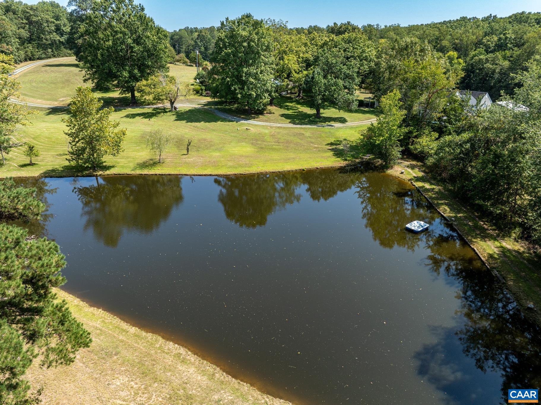 1128 Beaverdam Road Keswick, VA 22947 - Photo 69 of 74 a view of a lake with a yard