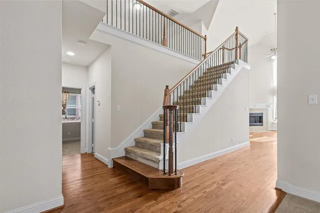 a view of staircase with white walls and a window